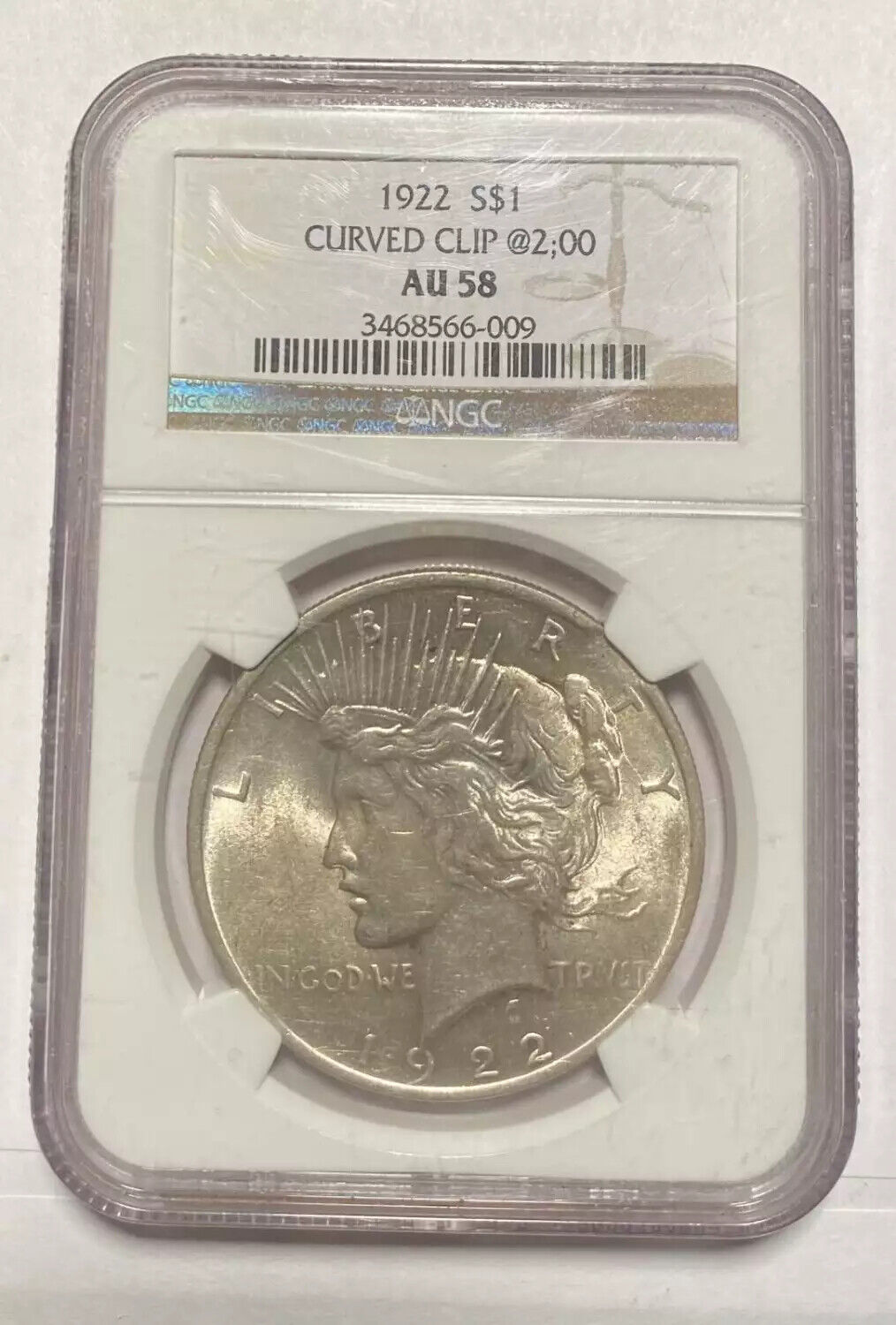 Peace Silver Dollar 1922 p NGC AU-58 1922 CURVED CLIP @2;00